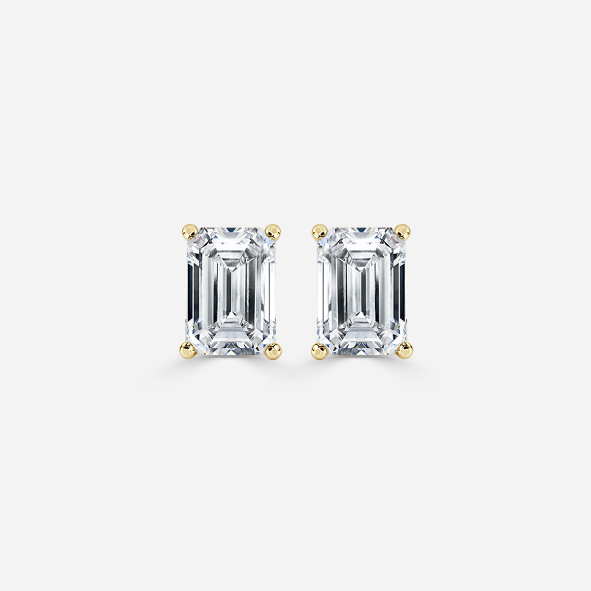 emerald diamond earrings in gold with diamonds