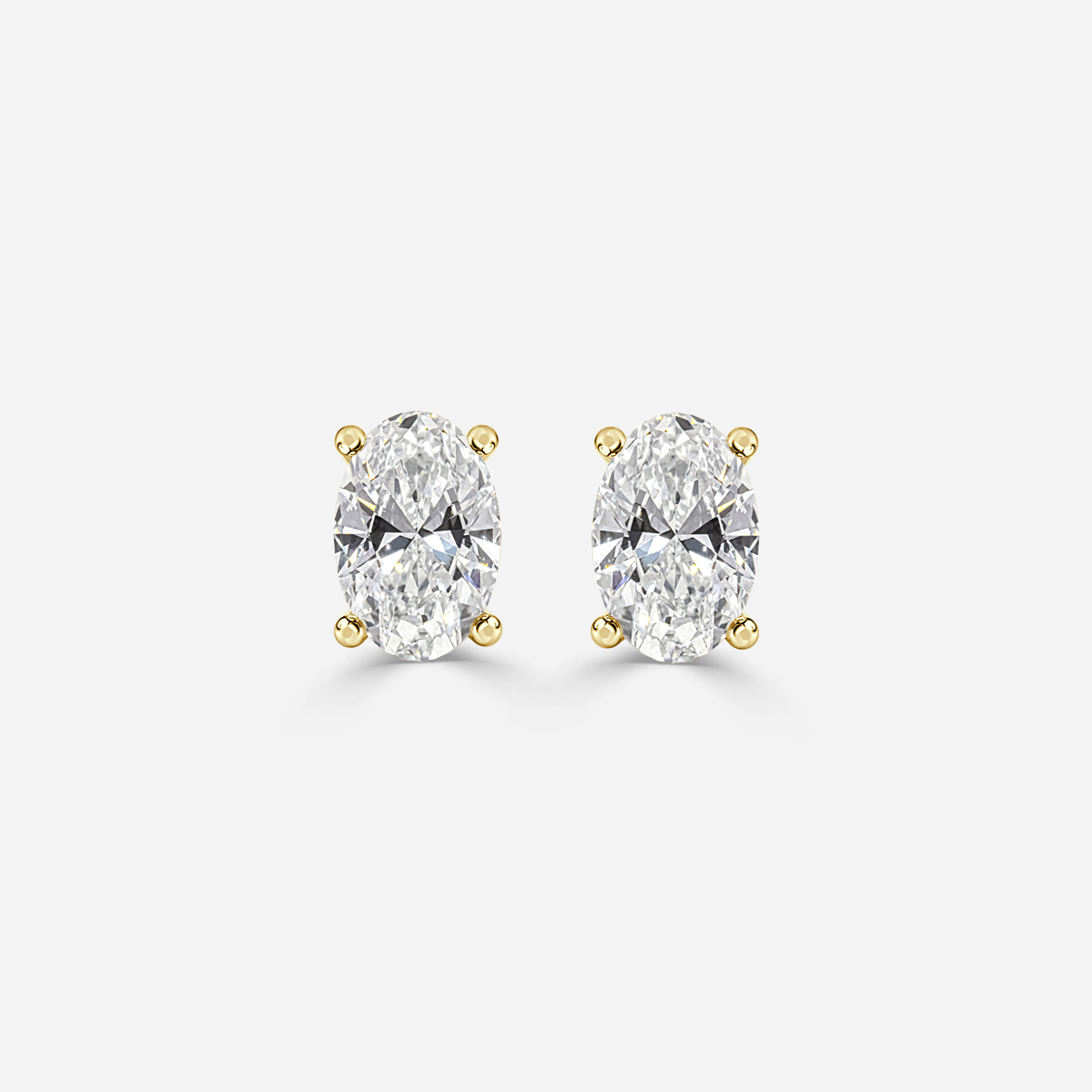 oval diamond earrings in gold with diamonds