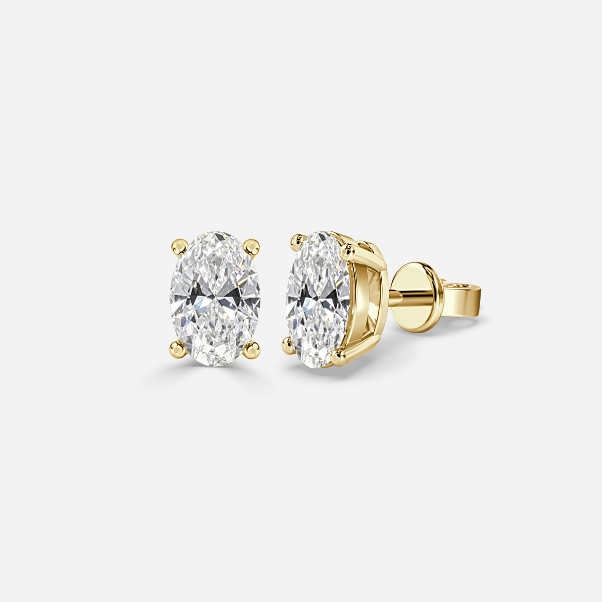 oval diamond earrings in gold with diamonds