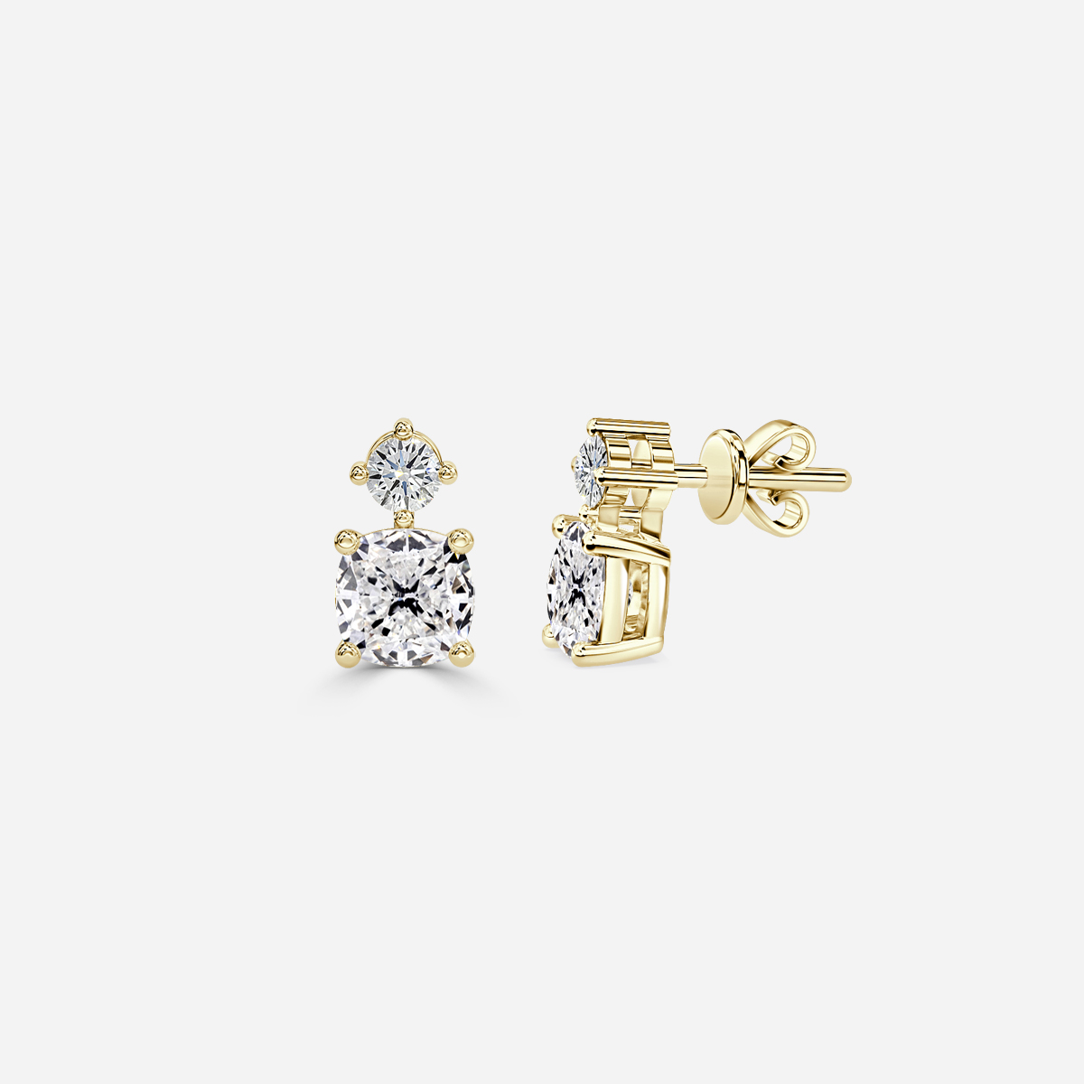 cushion diamond earrings in gold with diamonds