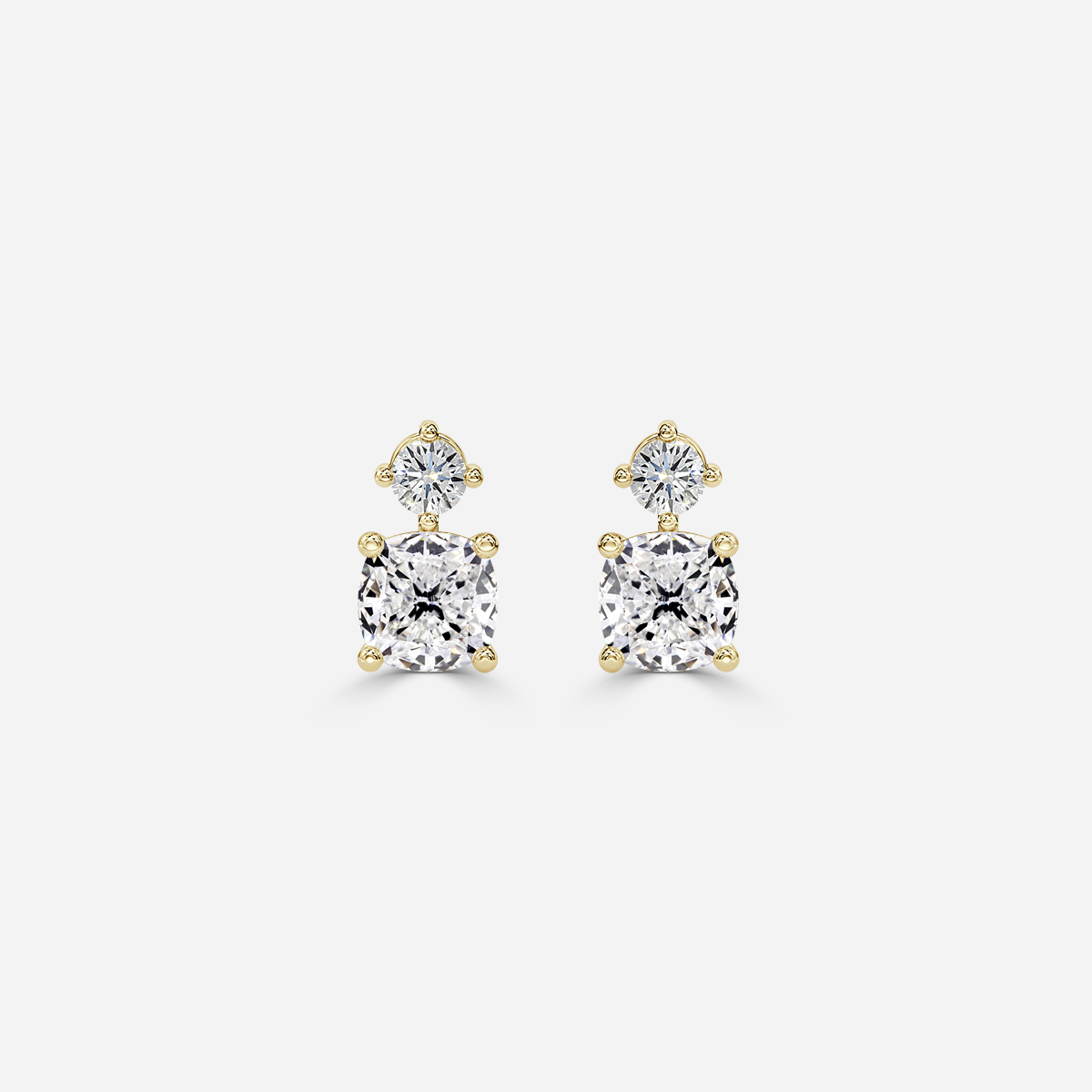 cushion diamond earrings in gold with diamonds