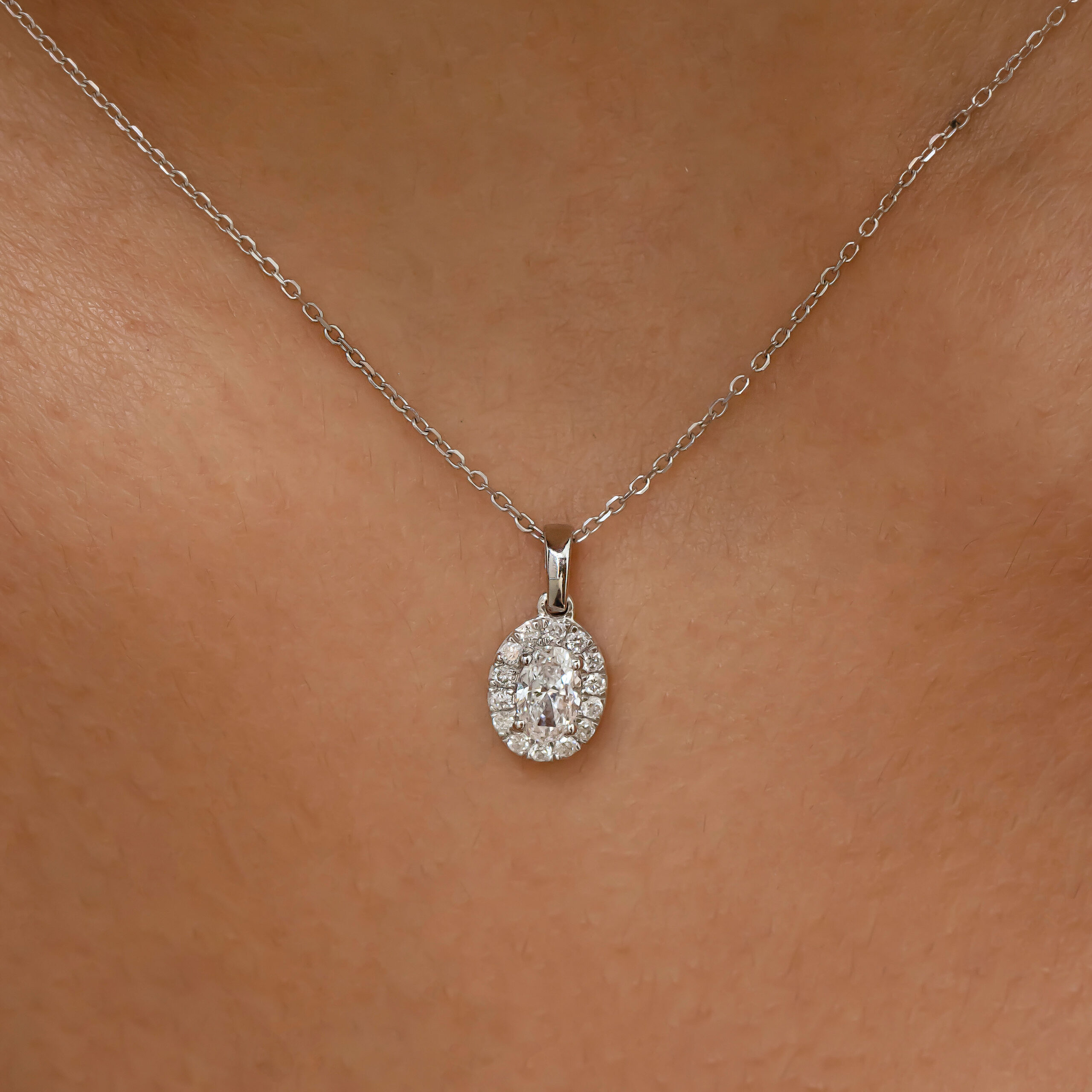oval diamond pendant in gold with diamonds