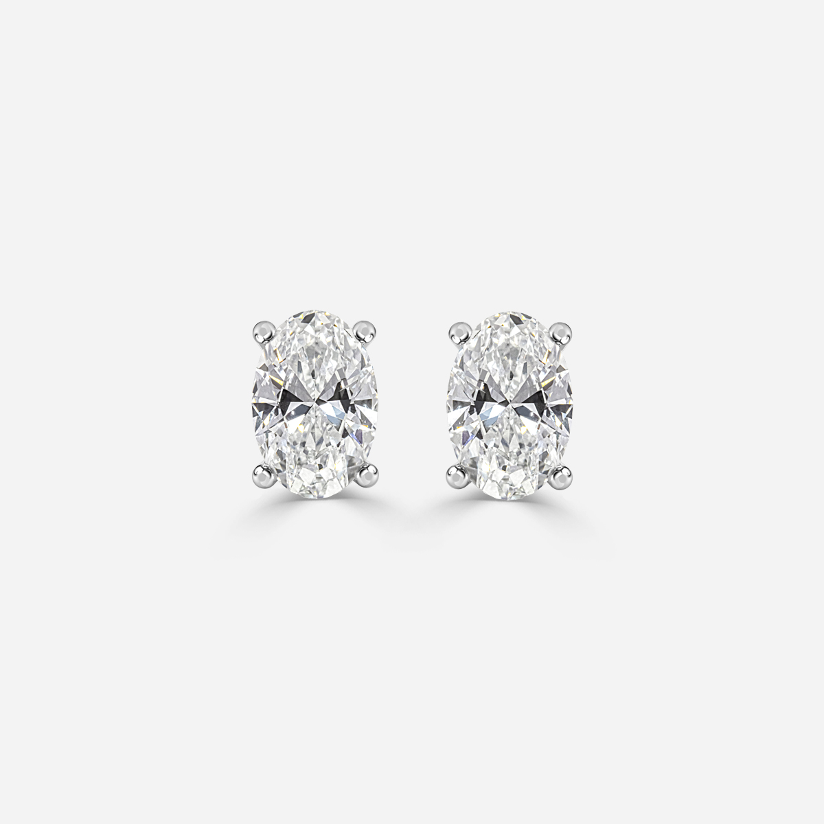 oval diamond earrings in gold with diamonds