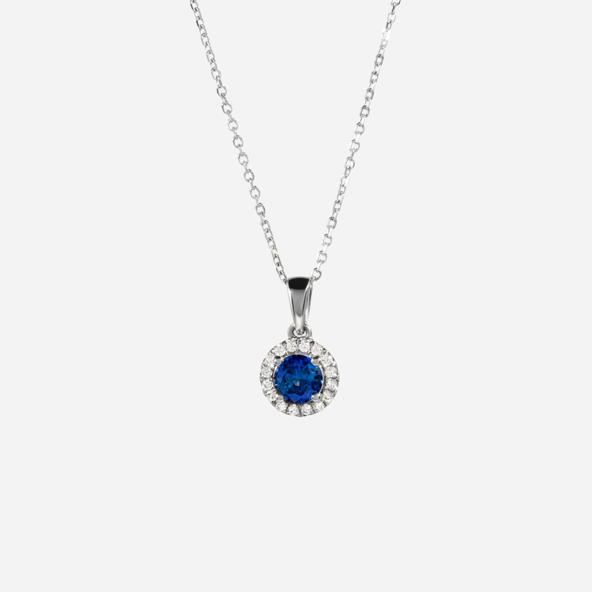 halo diamond pendant in gold with diamonds